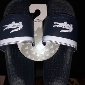 Navy and white Lacoste sandals